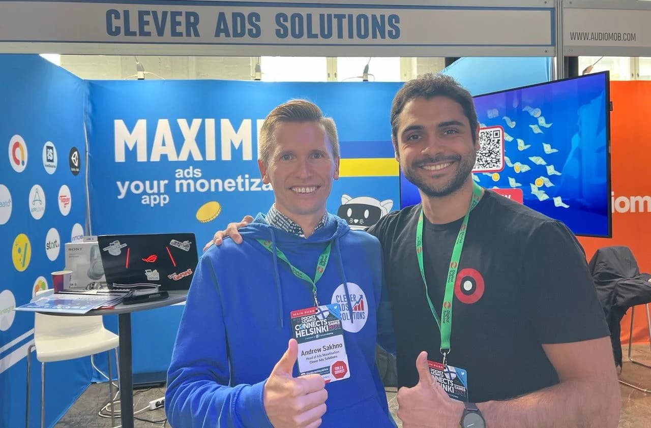 Andrew with a conference organiser at the CAS stand at Pocket Gamer Connects Helsinki, both giving a thumbs up