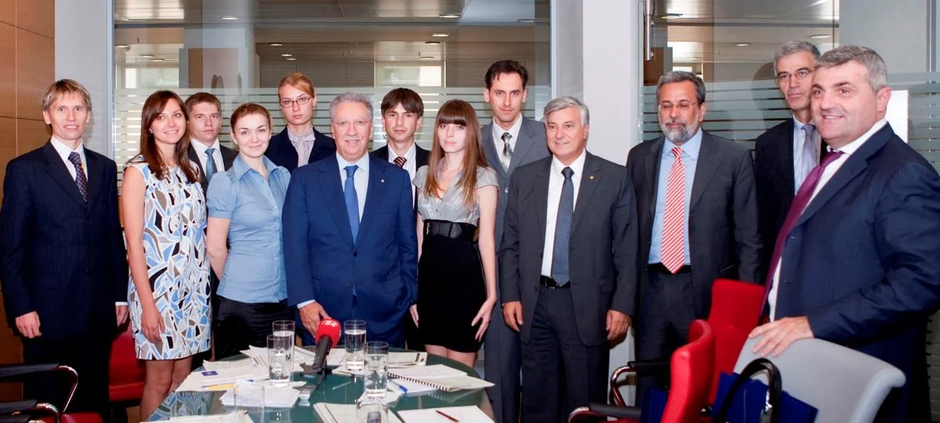The press group posing together in a meeting room in Athens