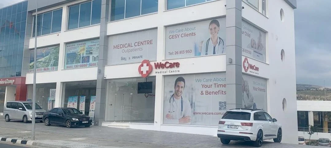 The WeCare Medical Centre building with large branded panels on the façade
